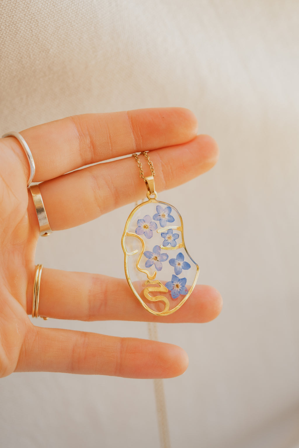 Collana "volto" con "Non ti scordar di me"