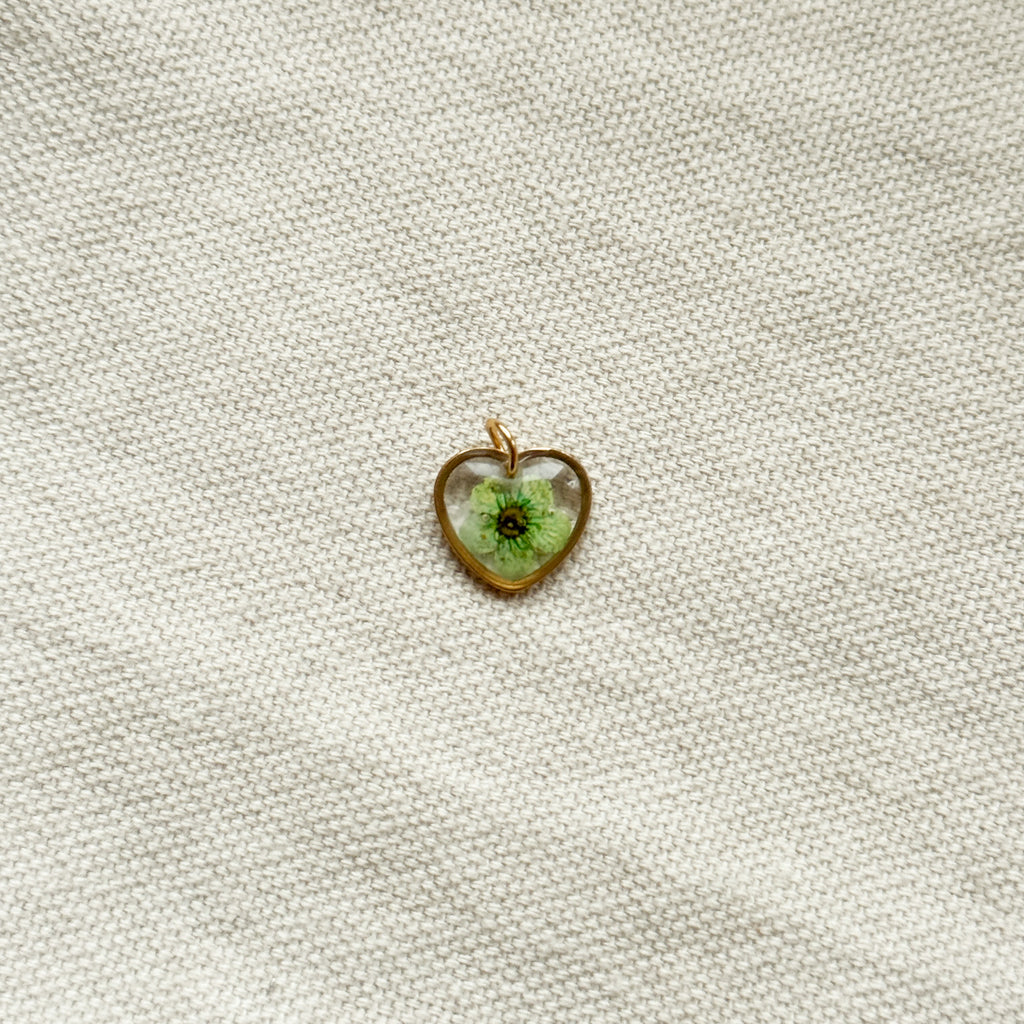 Ciondolo cuore trasparente con narciso verde